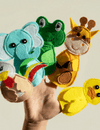 Little girl playing with her puppets at home